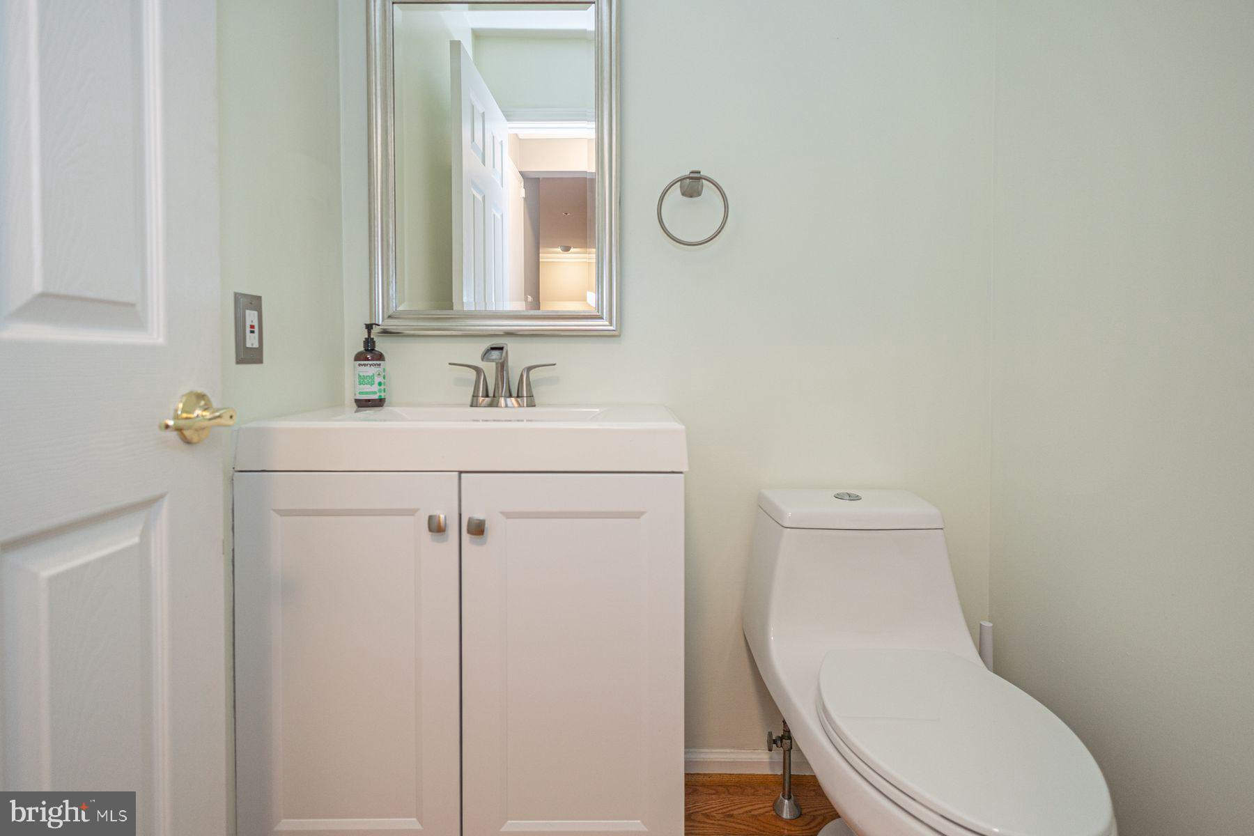 102 Waverly Lane, Unit 4 New Hope, PA 18938 - Photo 13 of 28 a white toilet sitting next to a bathroom sink