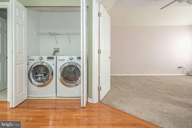 a view of a storage & utility room with a washer dryer