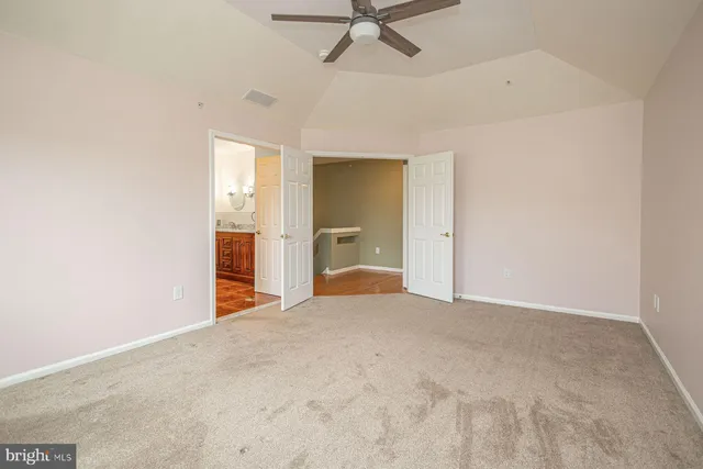 a big room with closet and windows