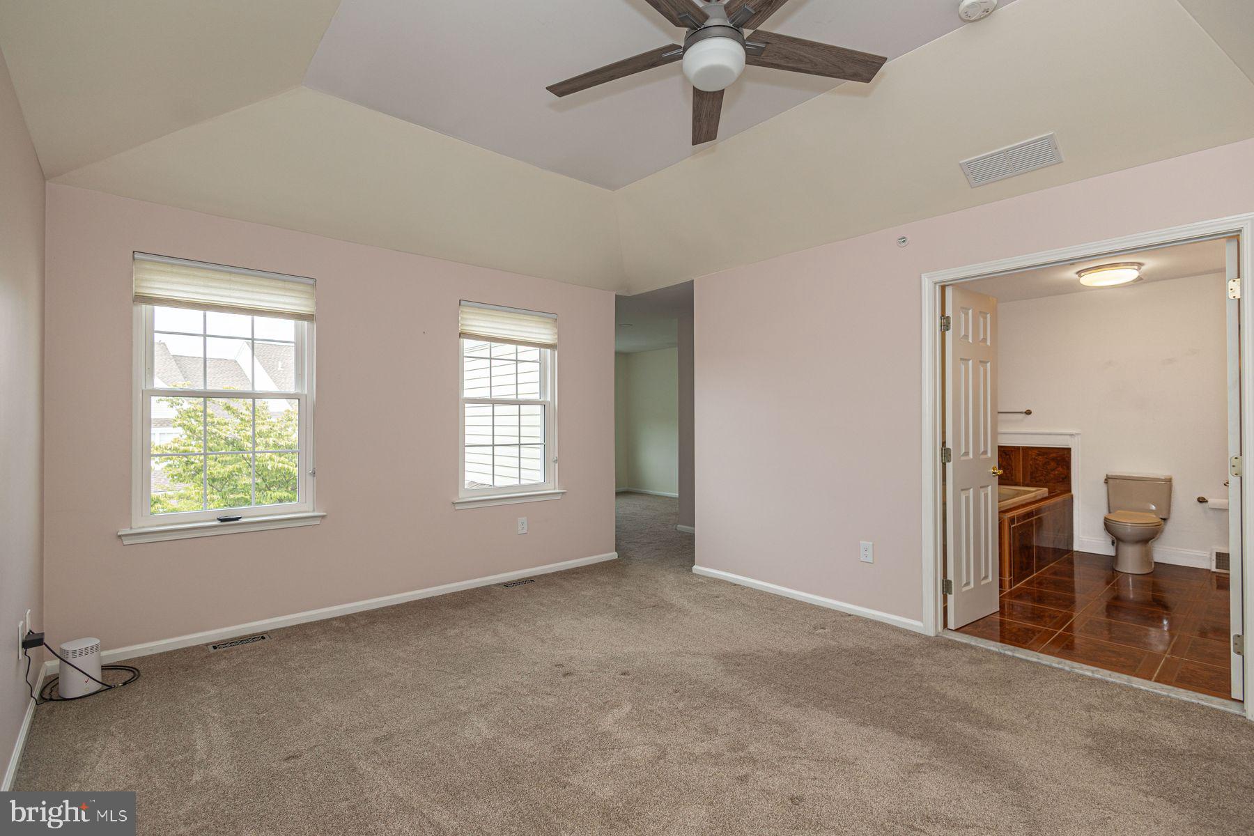 102 Waverly Lane, Unit 4 New Hope, PA 18938 - Photo 17 of 28 an empty room with fan and windows