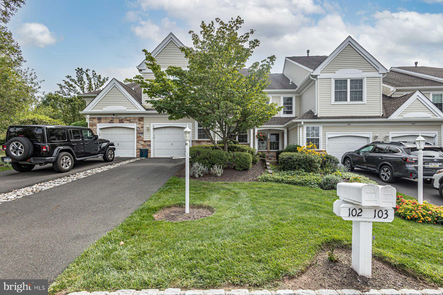 102 Waverly Lane, Unit 4 New Hope, PA 18938 - Photo 28 of 28 a front view of a house with a yard and trees
