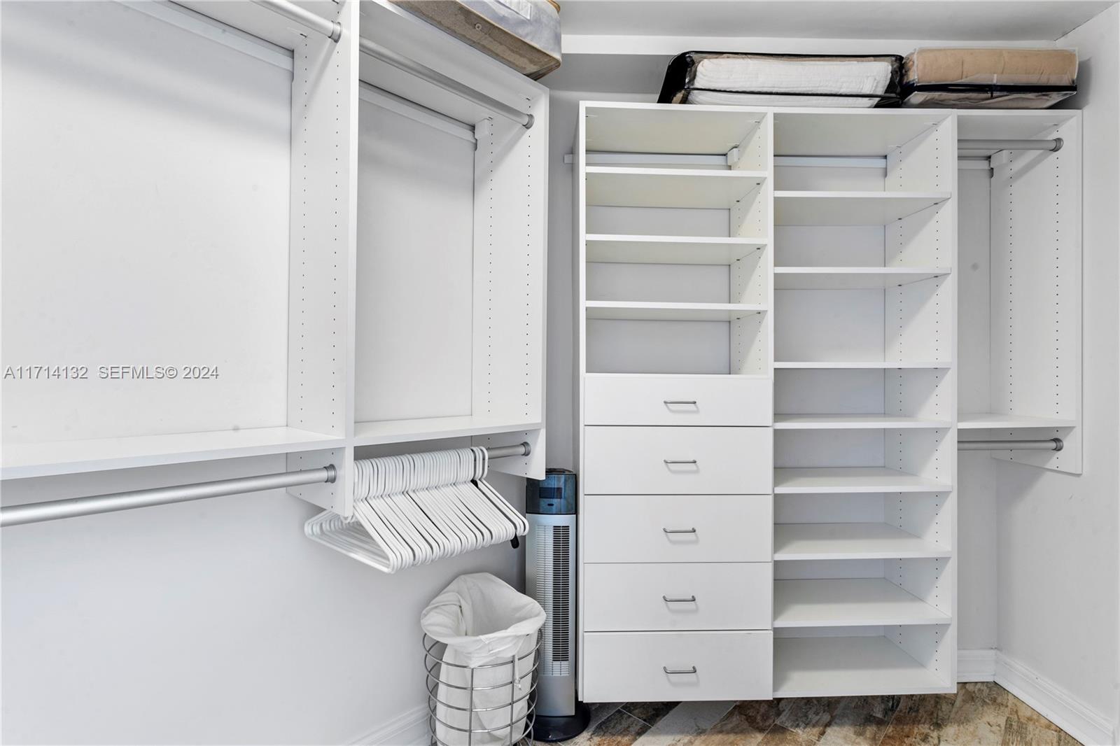 3000 North Ocean Drive, Unit 20A Riviera Beach, FL 33404 - Photo 15 of 43 a view of walk in closet with empty racks