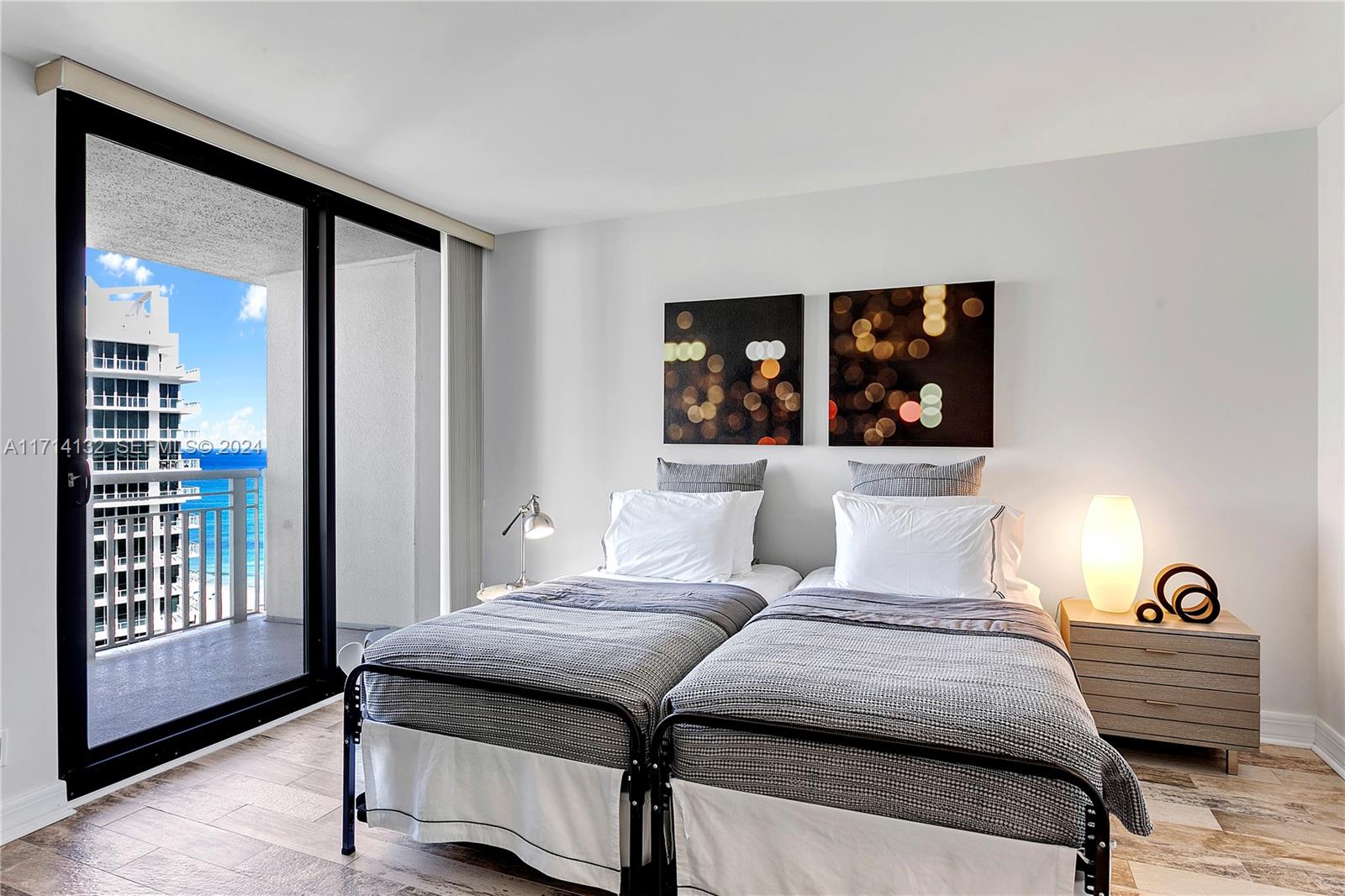 3000 North Ocean Drive, Unit 20A Riviera Beach, FL 33404 - Photo 17 of 43 a bedroom with a bed and a window