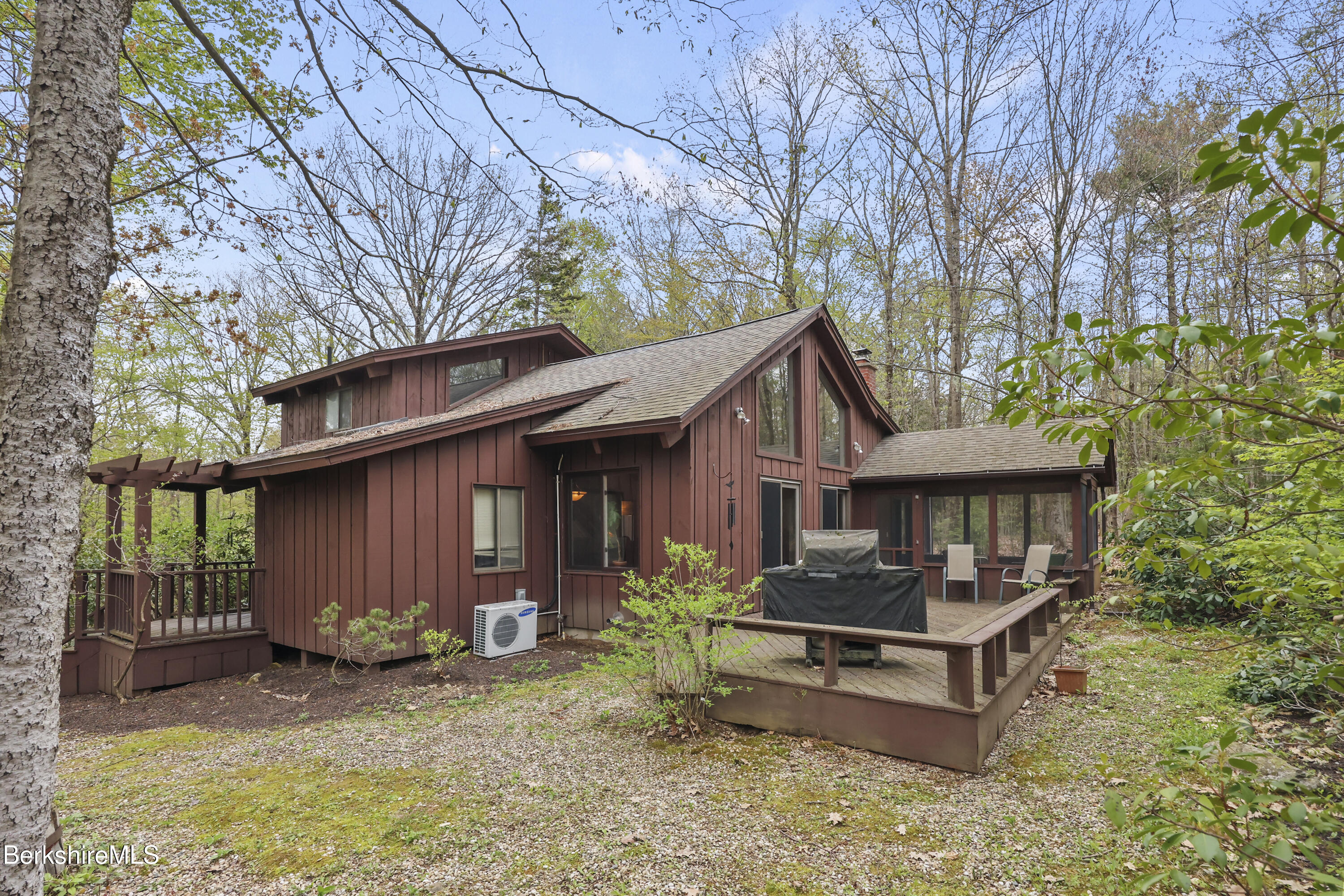 422 Bonny Rigg Hill Road Becket, MA 01223 - Photo 2 of 60 a backyard of a house with yard barbeque oven and outdoor seating