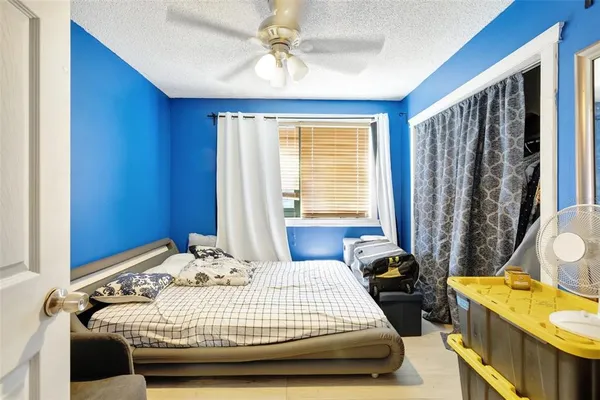a bedroom with a bed and a couch