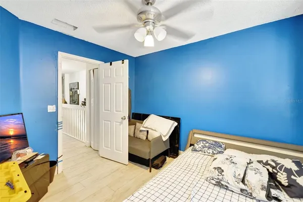 a bedroom with a bed and a closet
