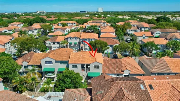 an aerial view of residential houses with outdoor space