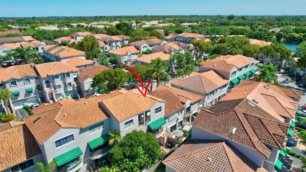 an aerial view of residential houses with outdoor space