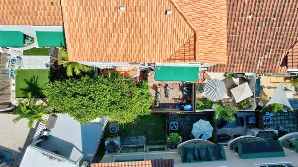 an aerial view of a houses and an outdoor space