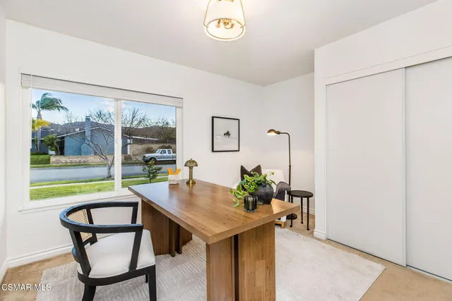 a kitchen with a table and chairs