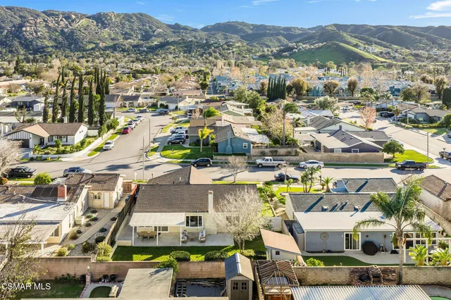 a view of houses with a swimming pool