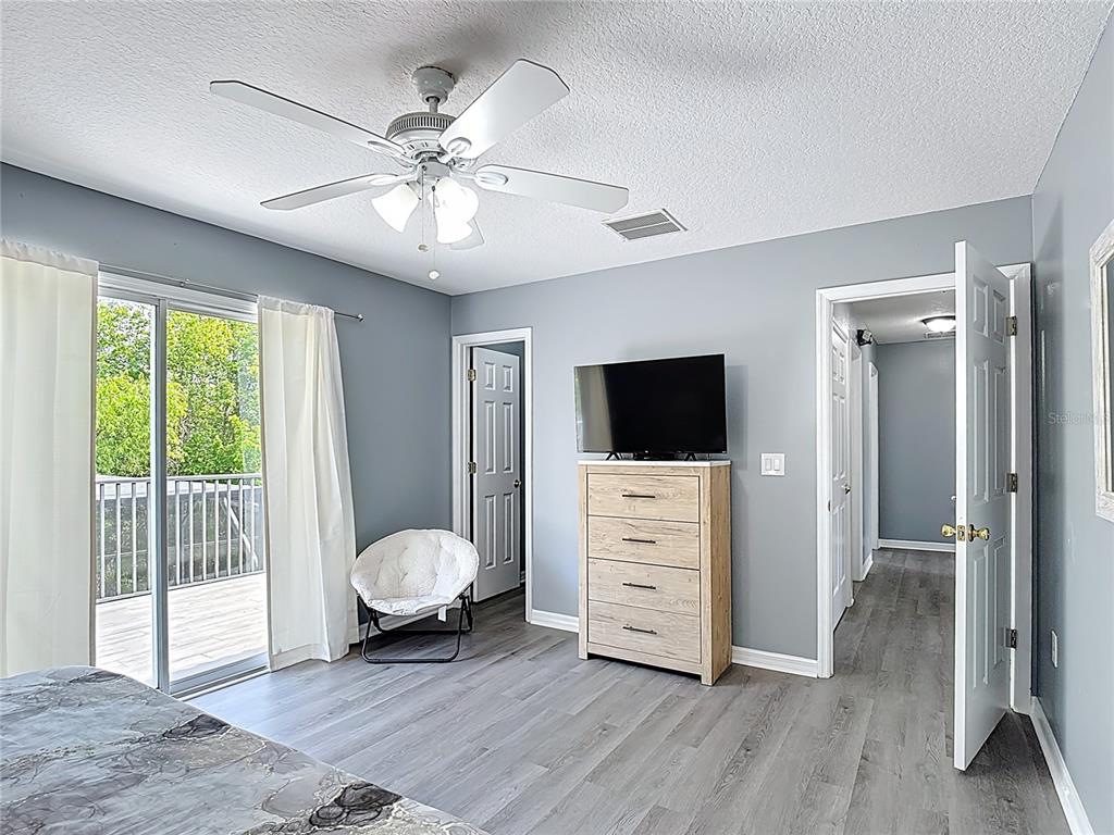 320 Mockingbird Road Davenport, FL 33896 - Photo 16 of 34 a living room with furniture and a flat screen tv