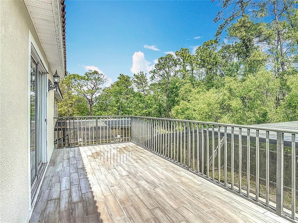 320 Mockingbird Road Davenport, FL 33896 - Photo 19 of 34 a view of balcony with wooden floor