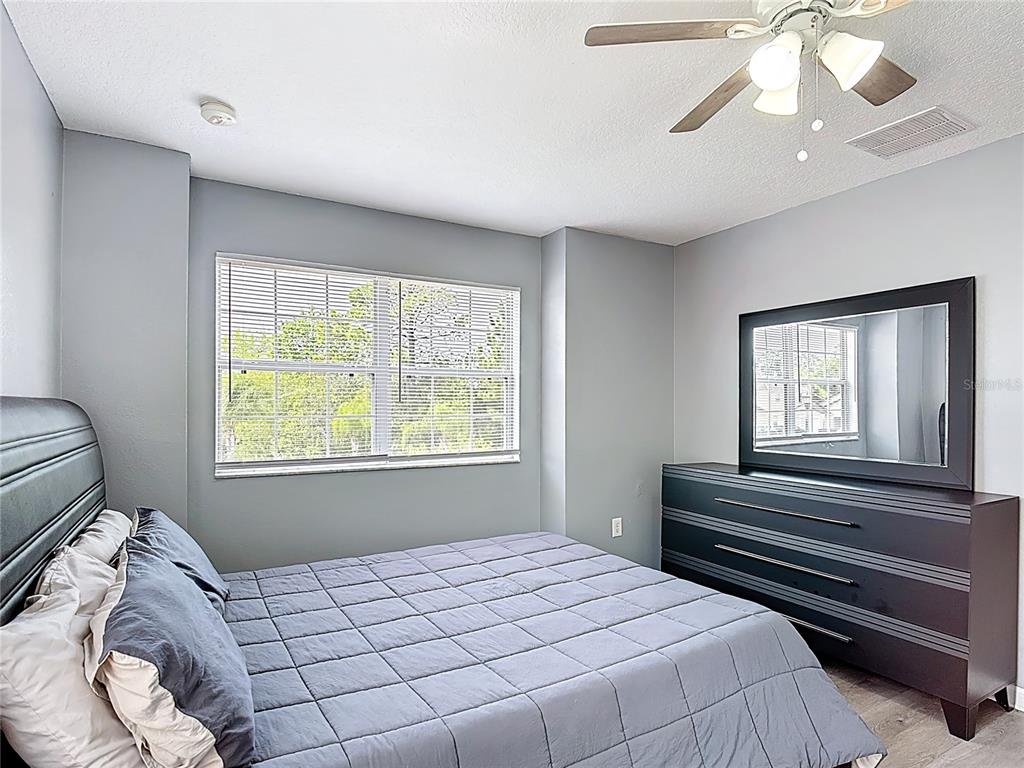 320 Mockingbird Road Davenport, FL 33896 - Photo 20 of 34 a bedroom with a bed and a window