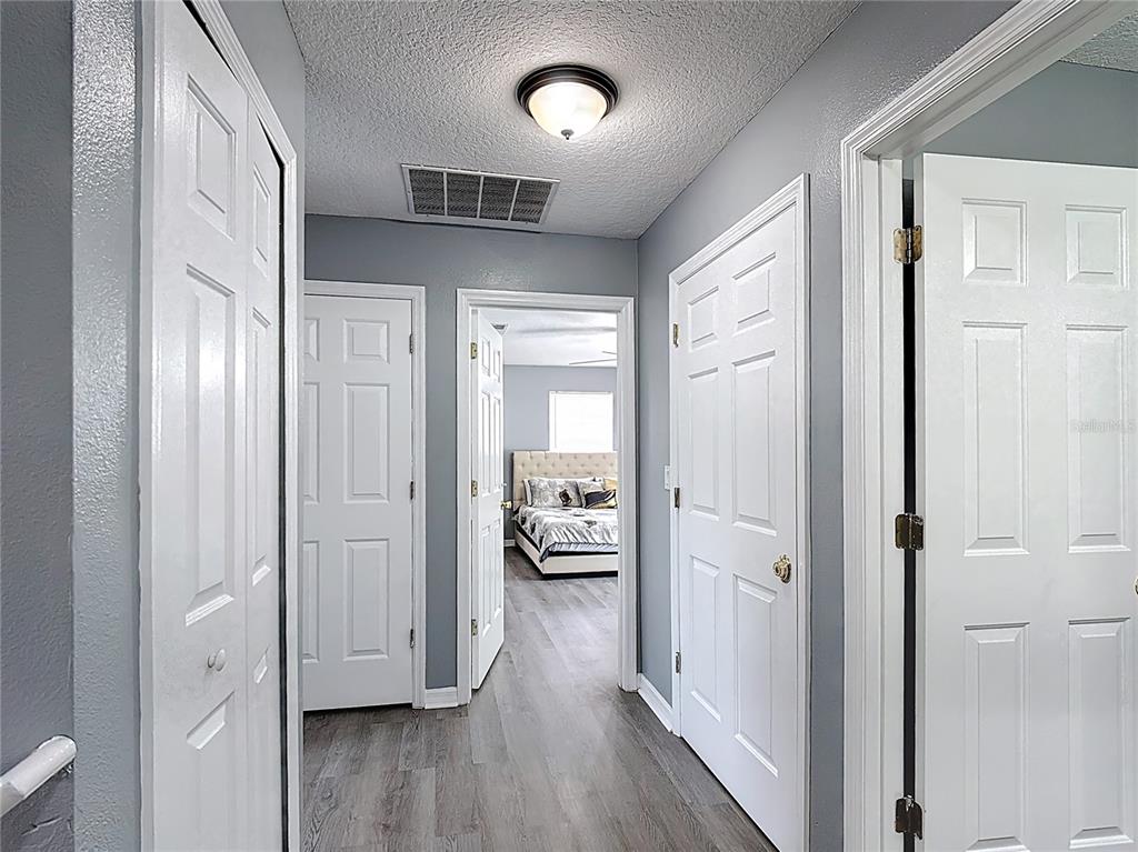 320 Mockingbird Road Davenport, FL 33896 - Photo 24 of 34 a view of a hallway with wooden floor and closet