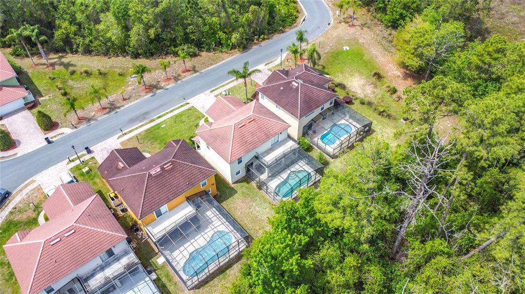 320 Mockingbird Road Davenport, FL 33896 - Photo 27 of 34 an aerial view of residential house with outdoor space and swimming pool