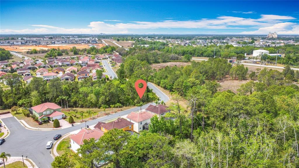 320 Mockingbird Road Davenport, FL 33896 - Photo 31 of 34 an aerial view of lake residential houses with outdoor space and swimming pool