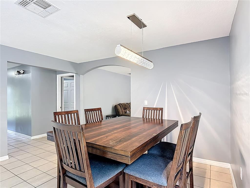 320 Mockingbird Road Davenport, FL 33896 - Photo 9 of 34 a view of a room with furniture and wooden floor