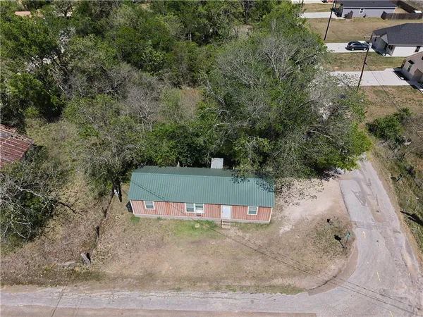 an aerial view of a yard with a house