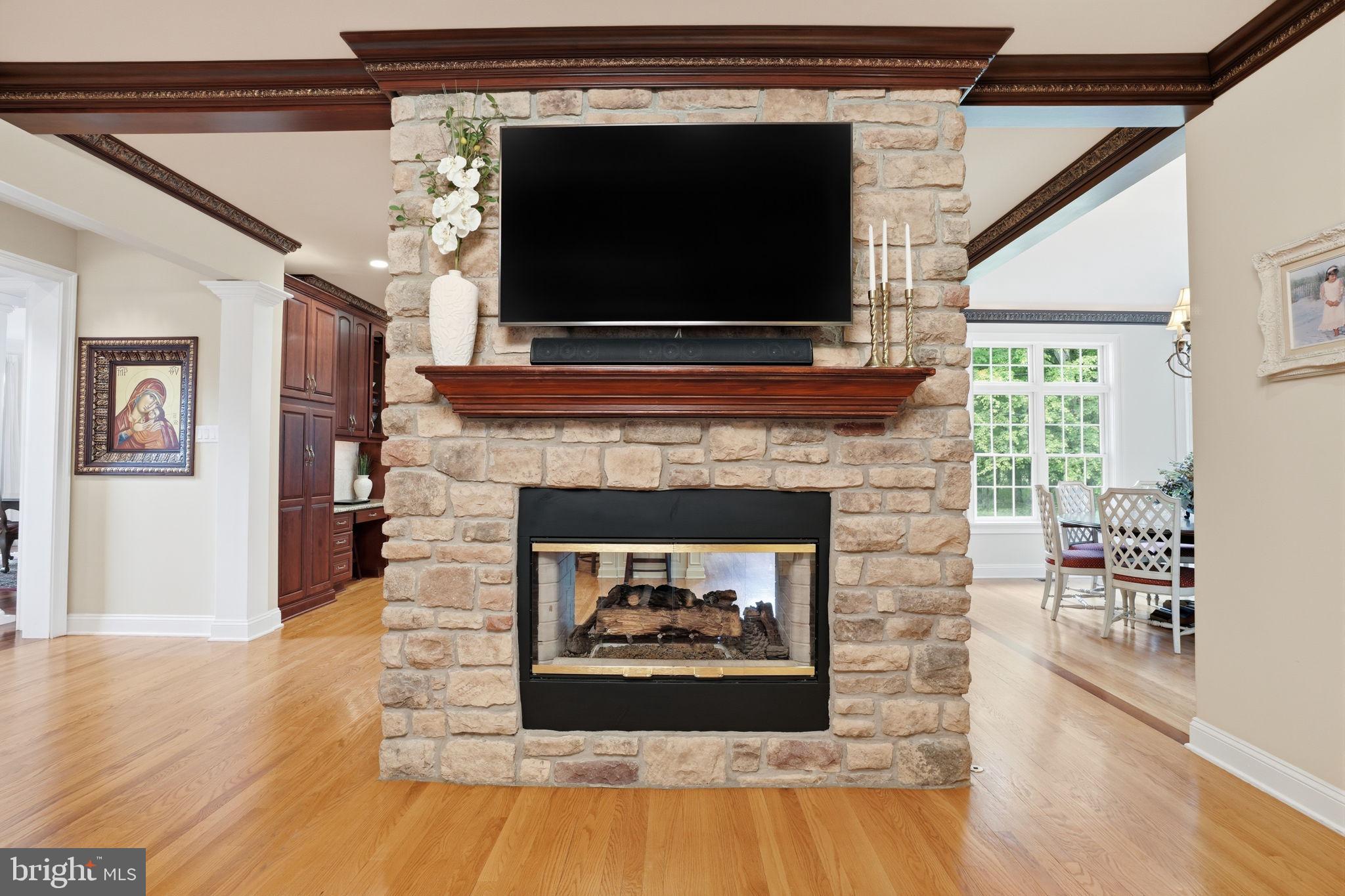 1588 Wrightstown Road Newtown, PA 18940 - Photo 39 of 81 a living room with a fireplace and a flat screen tv