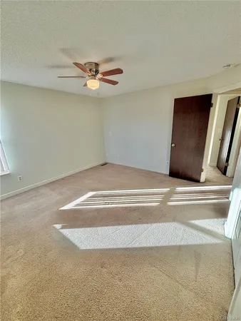 a living room with a ceiling fan
