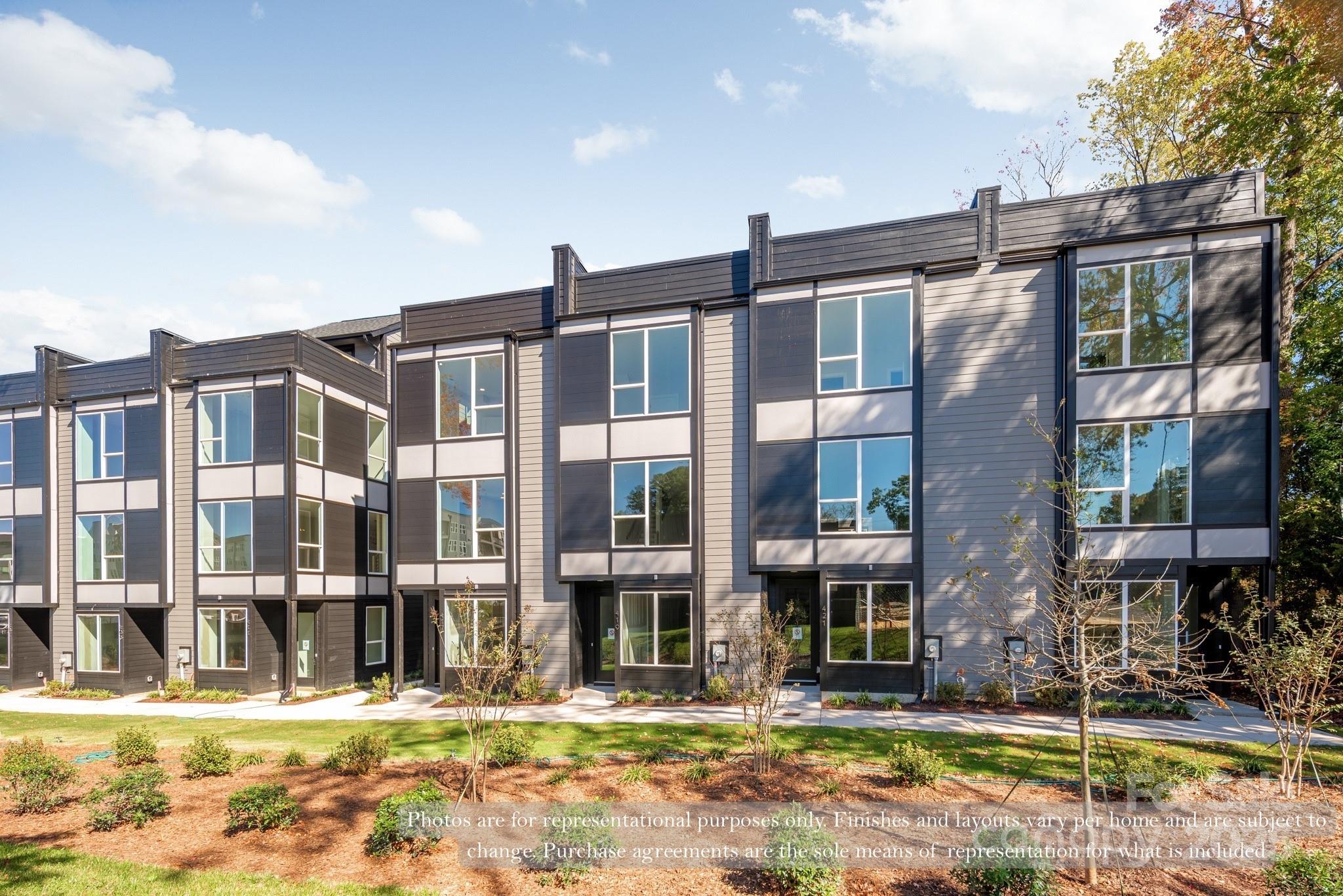 421 Devender Lane, Unit 2 Charlotte, NC 28217 - Photo 2 of 28 a front view of a building with street view