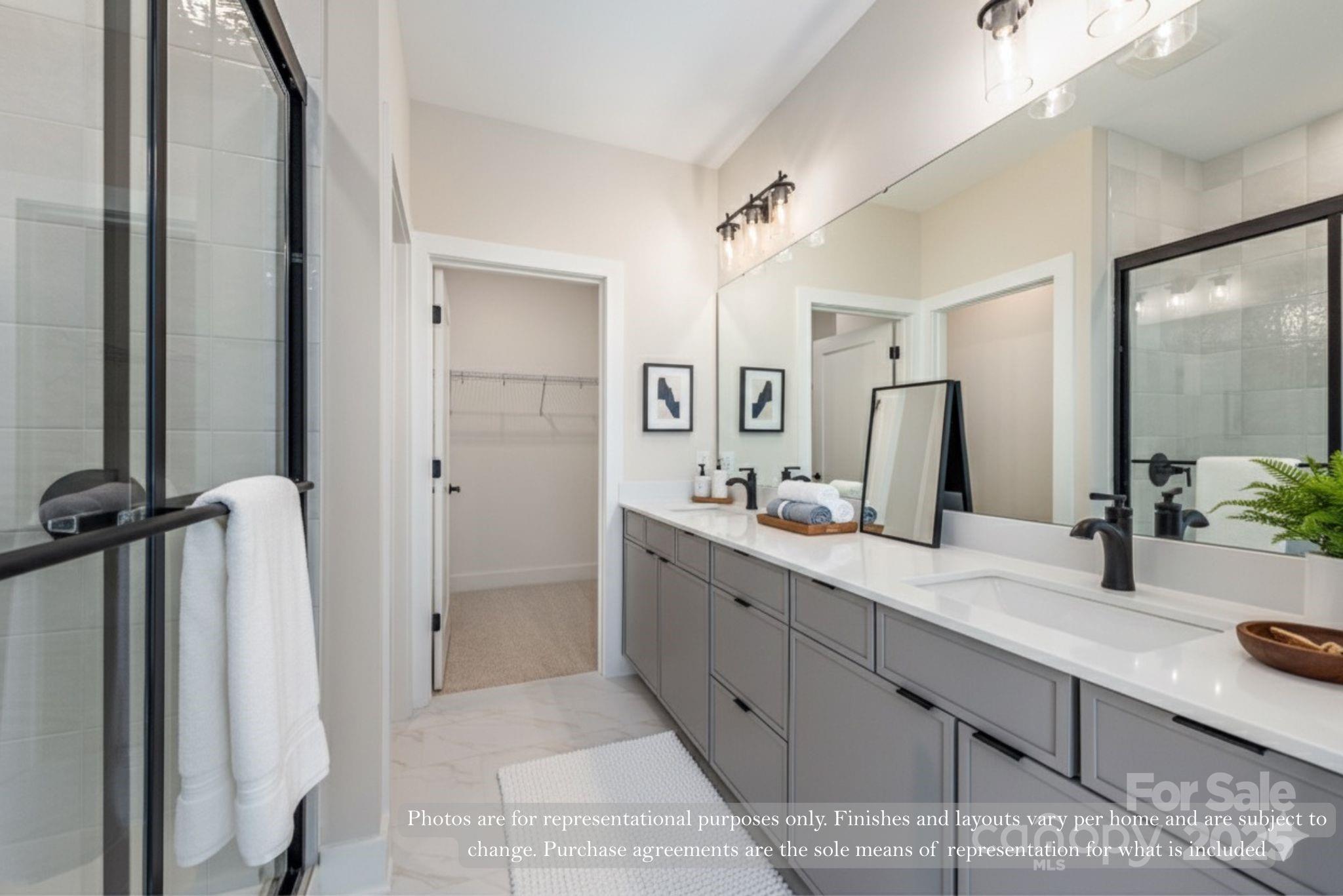 421 Devender Lane, Unit 2 Charlotte, NC 28217 - Photo 7 of 28 a spacious bathroom with a granite countertop sink mirror and shower