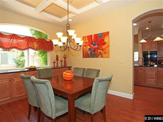 60 Ocelet Way Reno, NV 89511 - Photo 4 of 13 a view of a dining room with furniture wooden floor and chandelier