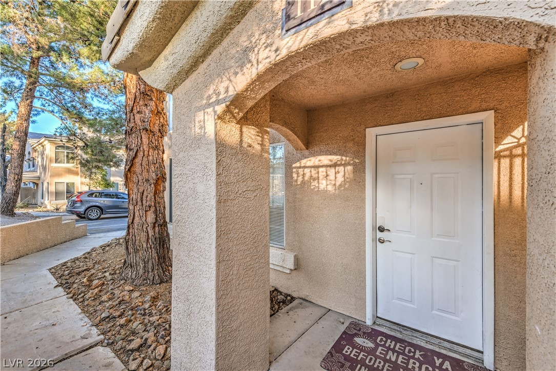 3950 South Sandhill Road, Unit 112 Las Vegas, NV 89121 - Photo 33 of 33 Property entrance featuring stucco siding