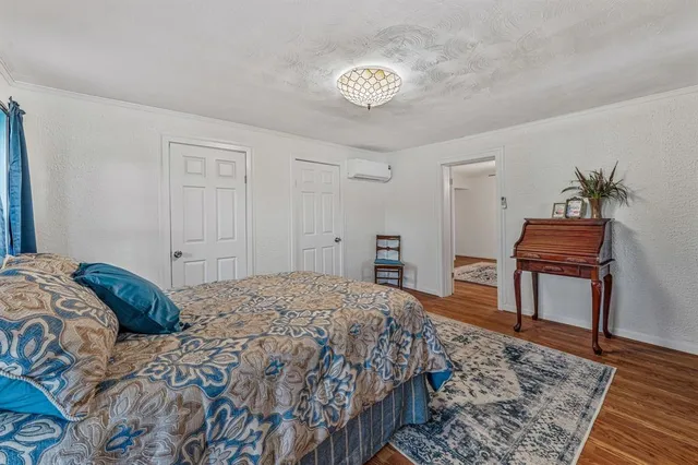 a bedroom with a bed and a table in it