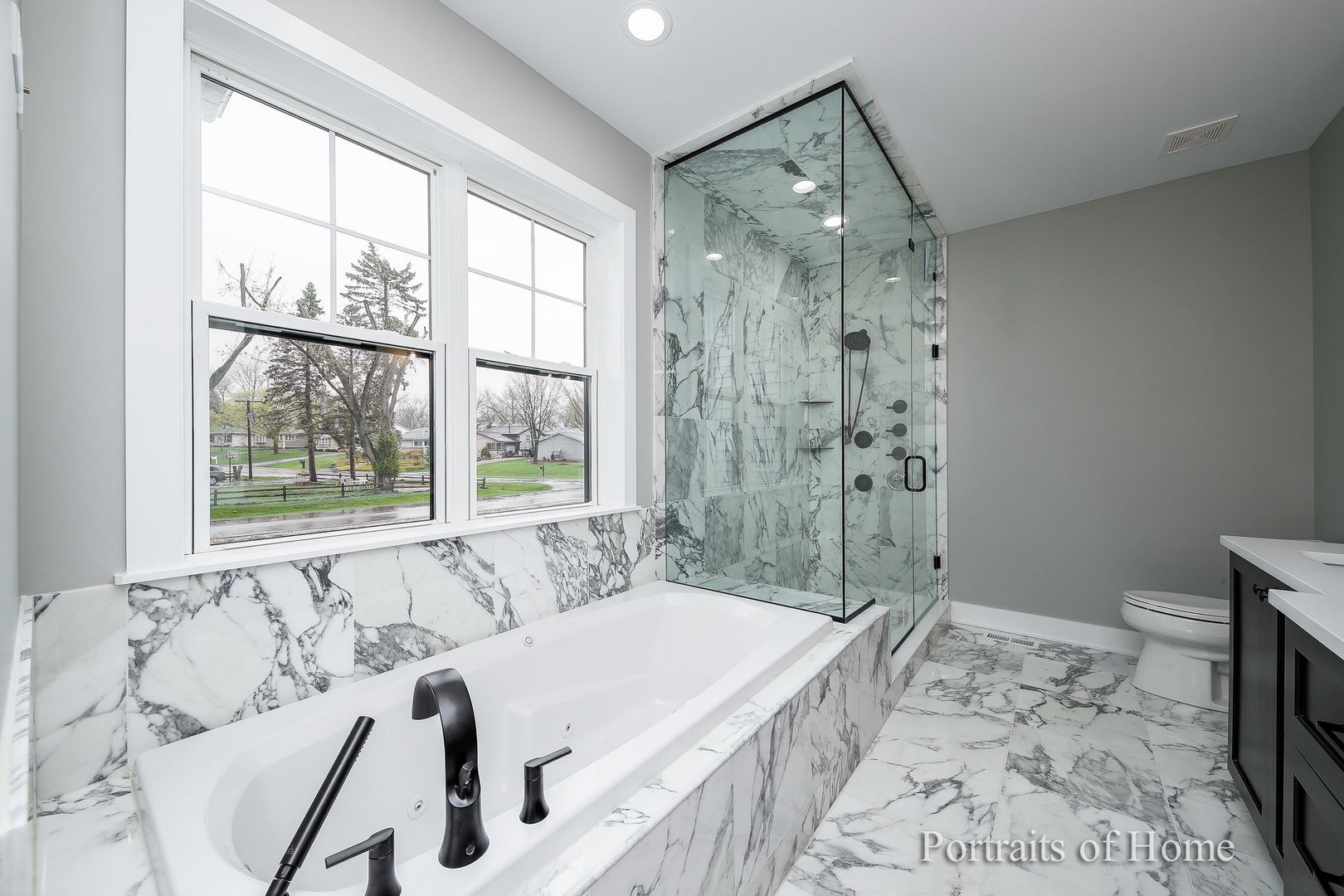 N105 Nepil Avenue Wheaton, IL 60187 - Photo 12 of 17 a spacious bathroom with a tub sink and shower