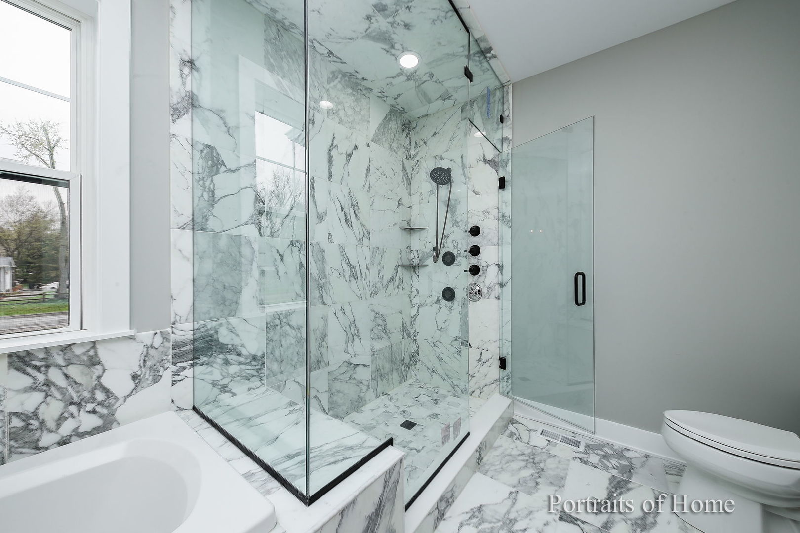 N105 Nepil Avenue Wheaton, IL 60187 - Photo 13 of 17 a bathroom with a shower and a toilet