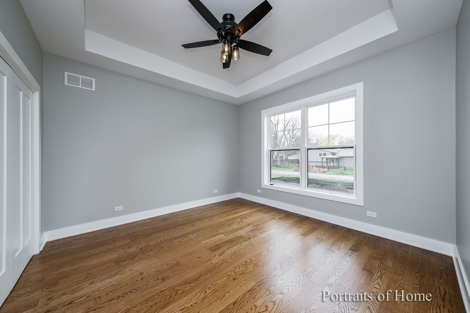 N105 Nepil Avenue Wheaton, IL 60187 - Photo 14 of 17 an empty room with wooden floor and windows