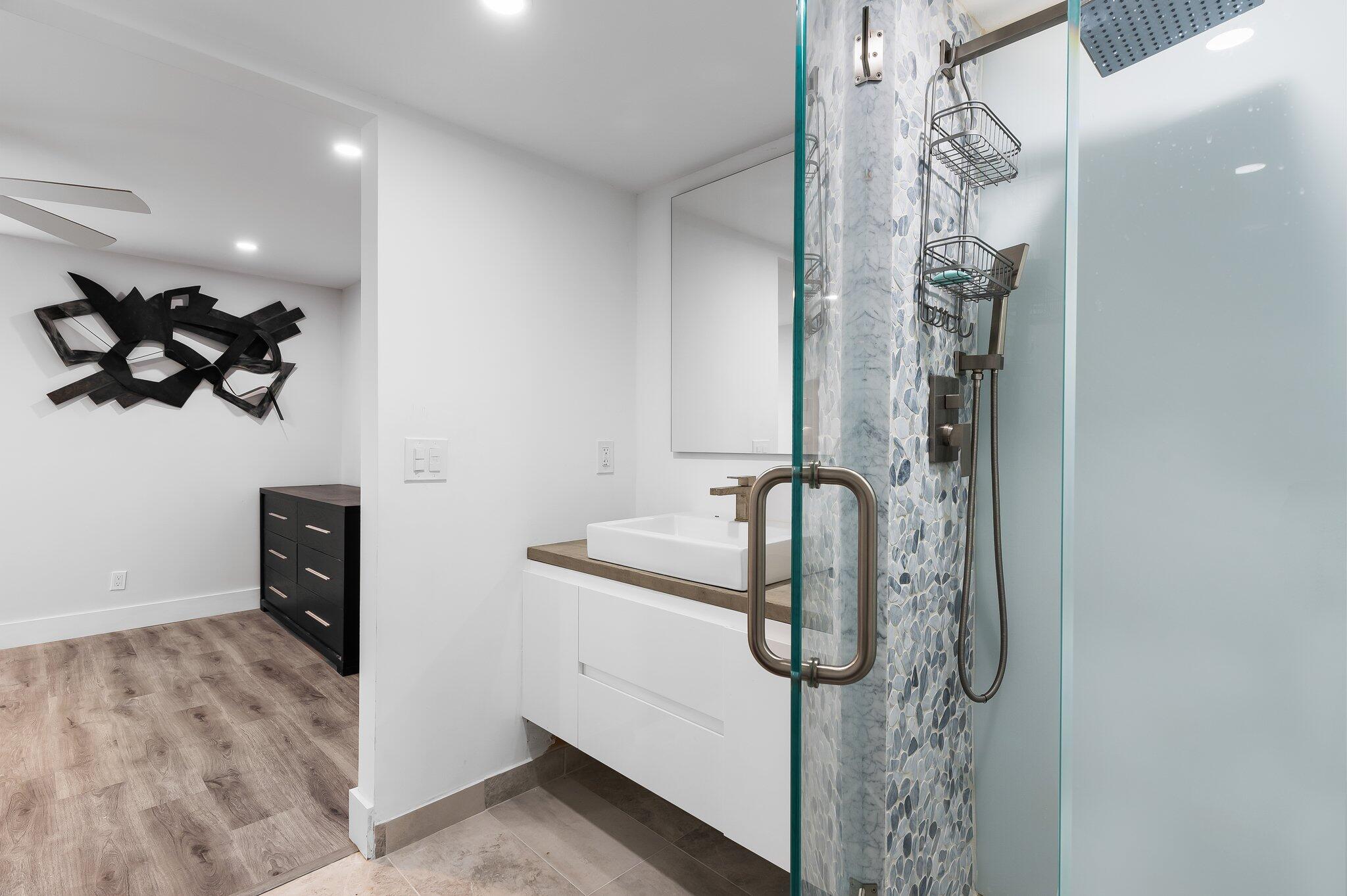 6 Royal Palm Way, Unit 509 Boca Raton, FL 33432 - Photo 12 of 23 a bathroom with a sink and mirror