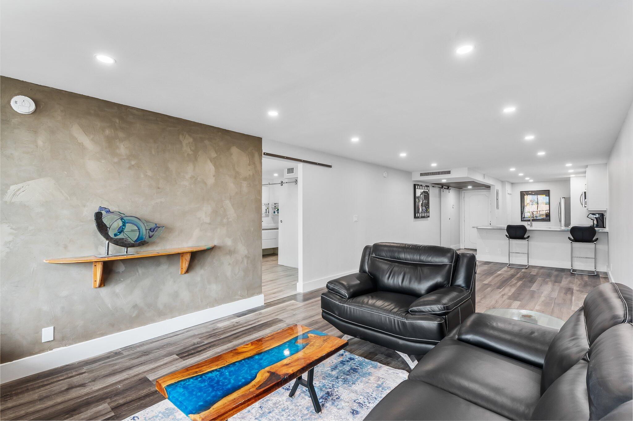 6 Royal Palm Way, Unit 509 Boca Raton, FL 33432 - Photo 6 of 23 a living room with furniture and a couch