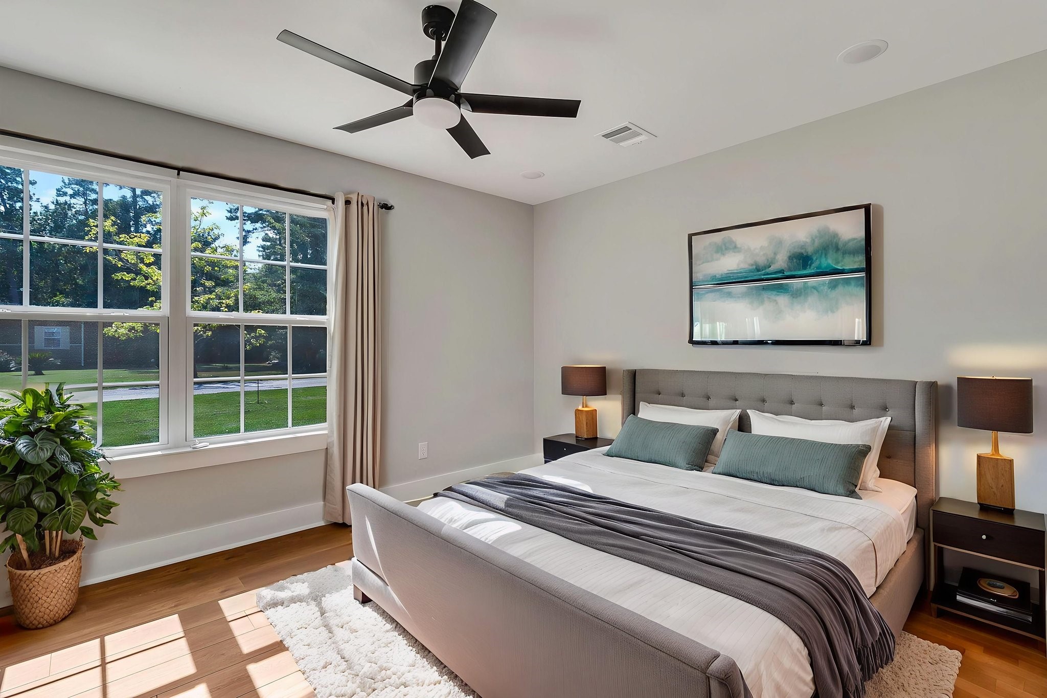 131 Pawnee Onalaska, TX 77360 - Photo 17 of 23 a bedroom with a large bed and a potted plant