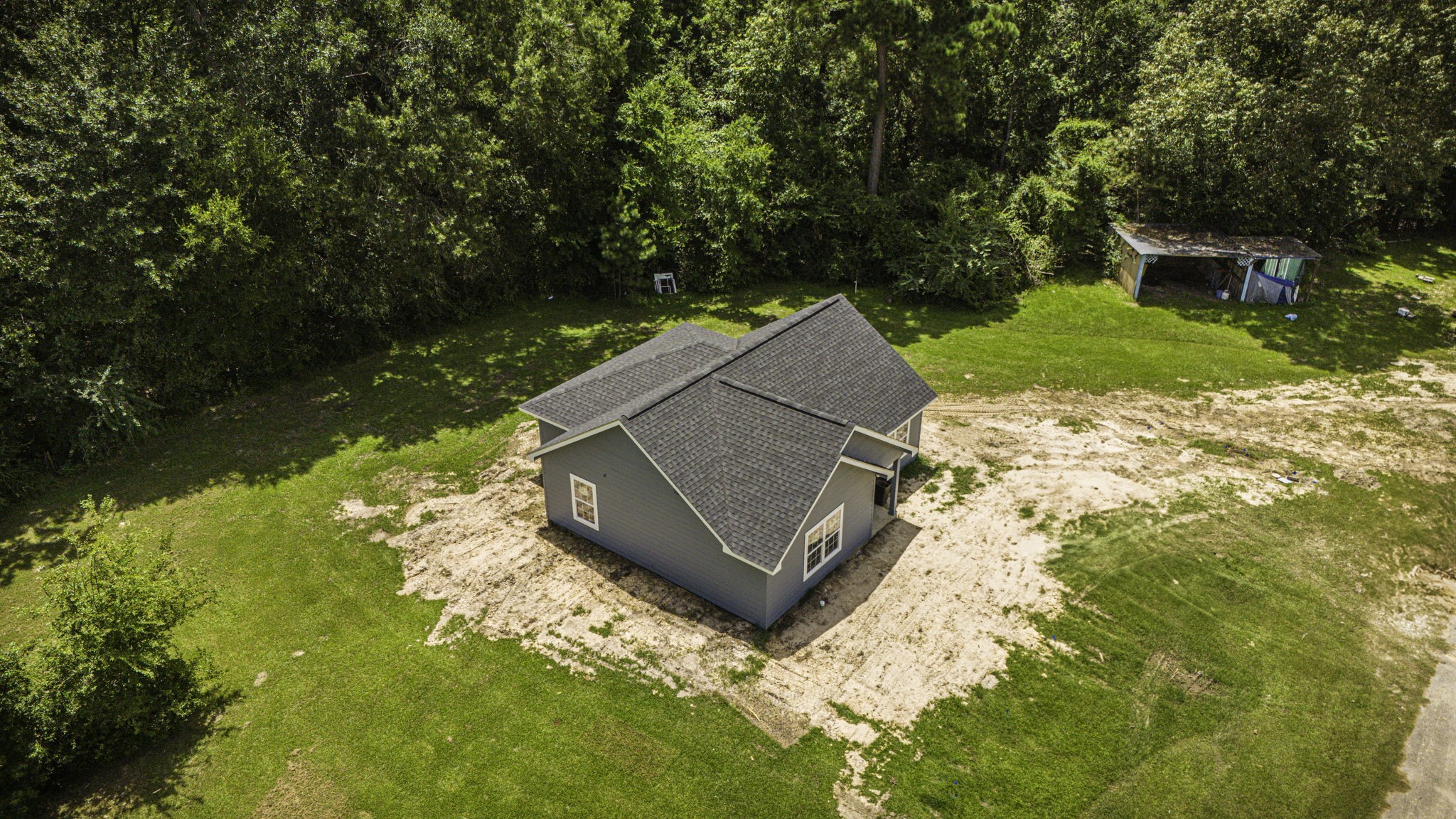 131 Pawnee Onalaska, TX 77360 - Photo 18 of 23 a view of backyard with swimming pool and outdoor seating