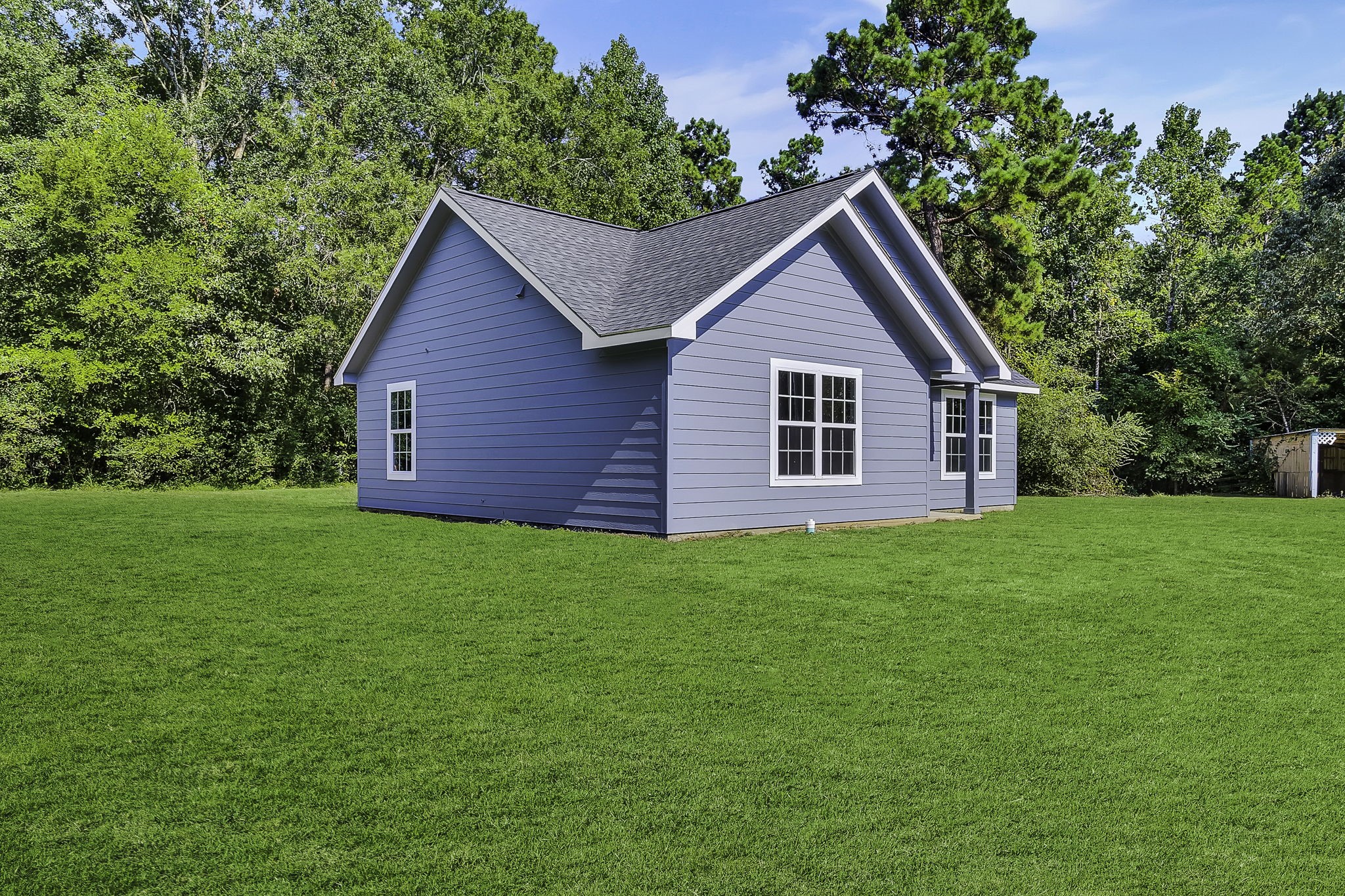 131 Pawnee Onalaska, TX 77360 - Photo 2 of 23 a view of a house with yard and tree in the background