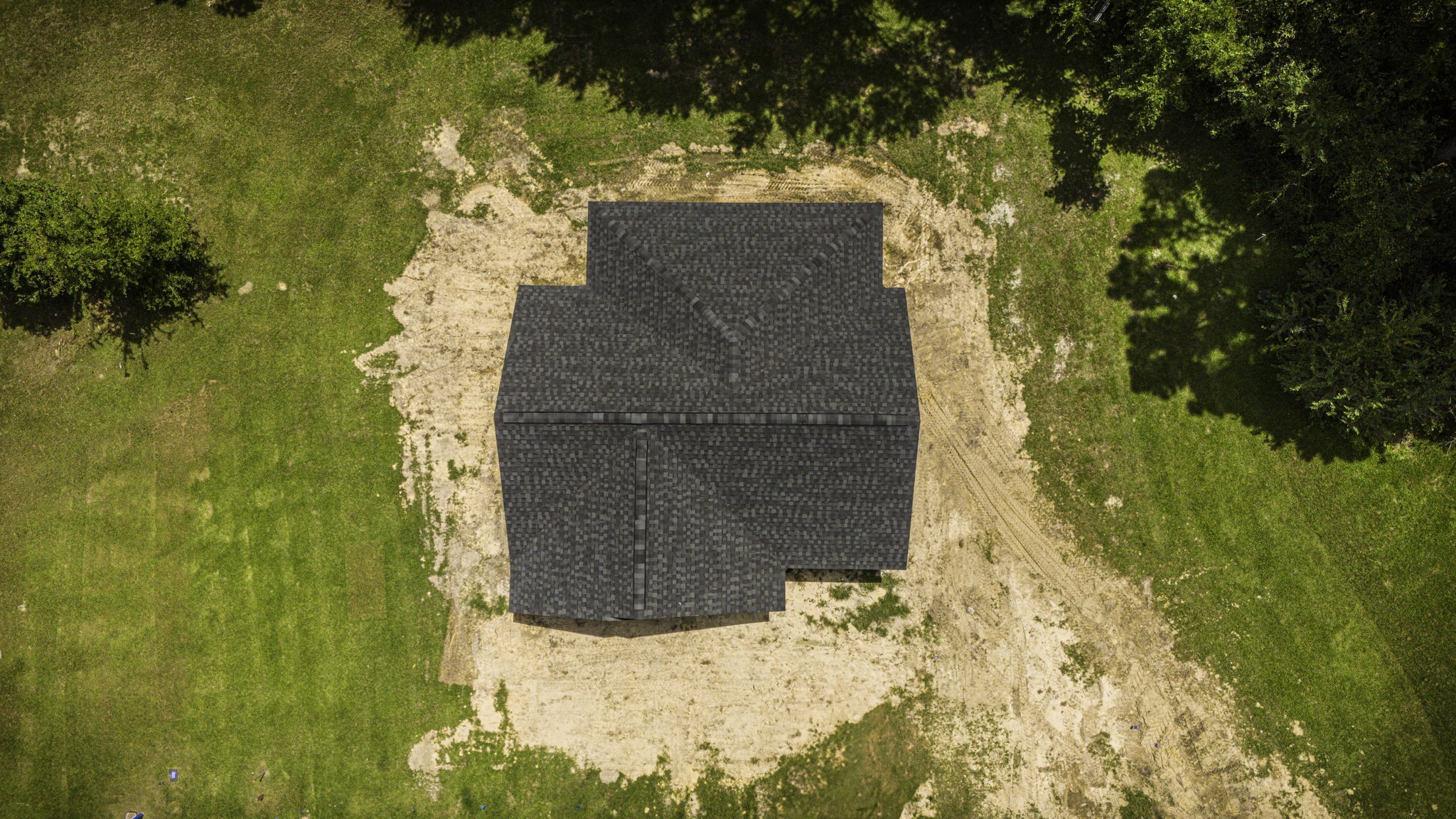 131 Pawnee Onalaska, TX 77360 - Photo 21 of 23 a building with a trees in front of it