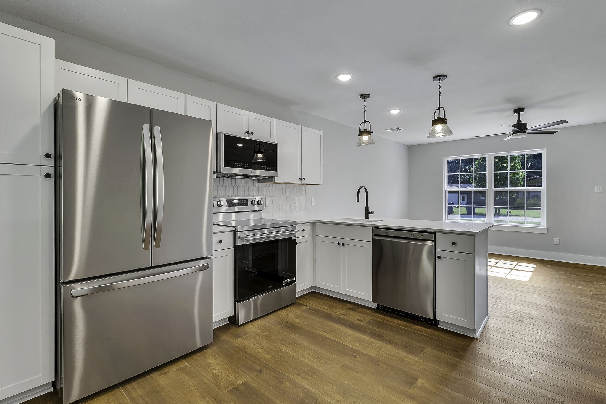 131 Pawnee Onalaska, TX 77360 - Photo 6 of 23 a kitchen with a refrigerator stove and sink