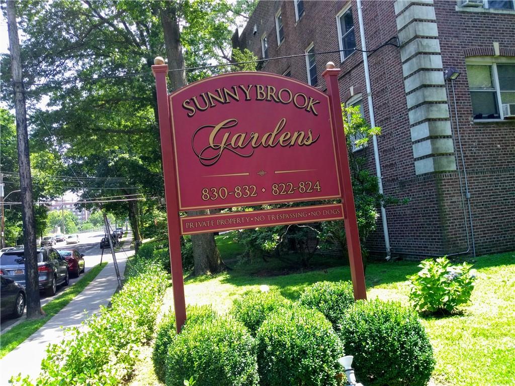 a sign that is on a brick building