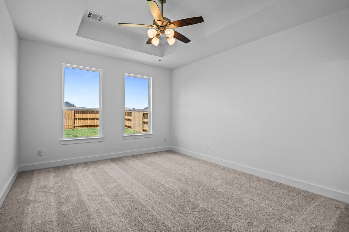 305 Gambels Quail Road Waller, TX 77484 - Photo 10 of 26 Step into your serene sanctuary—the primary bedroom of your dreams, nestled in stunning new construction.