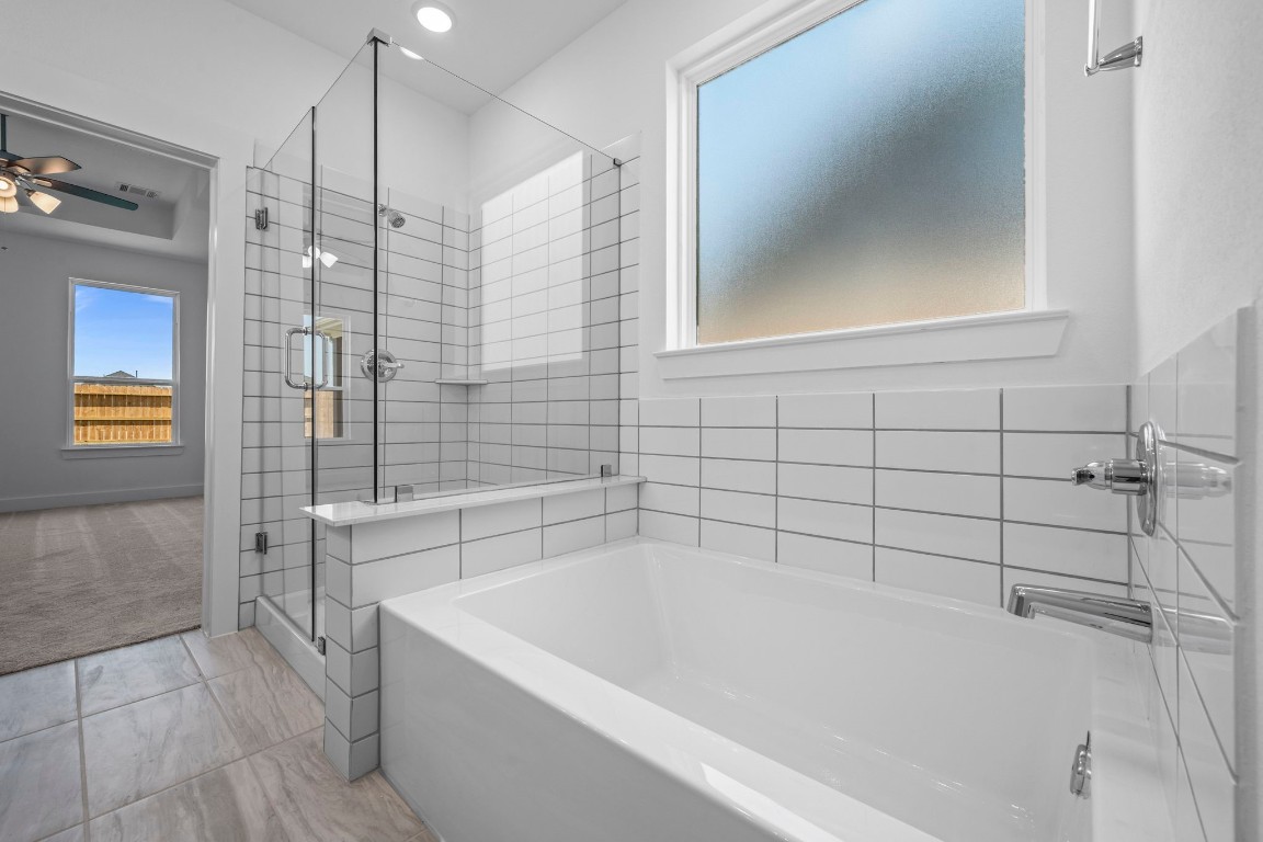 305 Gambels Quail Road Waller, TX 77484 - Photo 12 of 26 The modern finishes and thoughtful design elements—like the spacious layout and clean lines—bring a fresh, inviting vibe that makes you feel right at home.