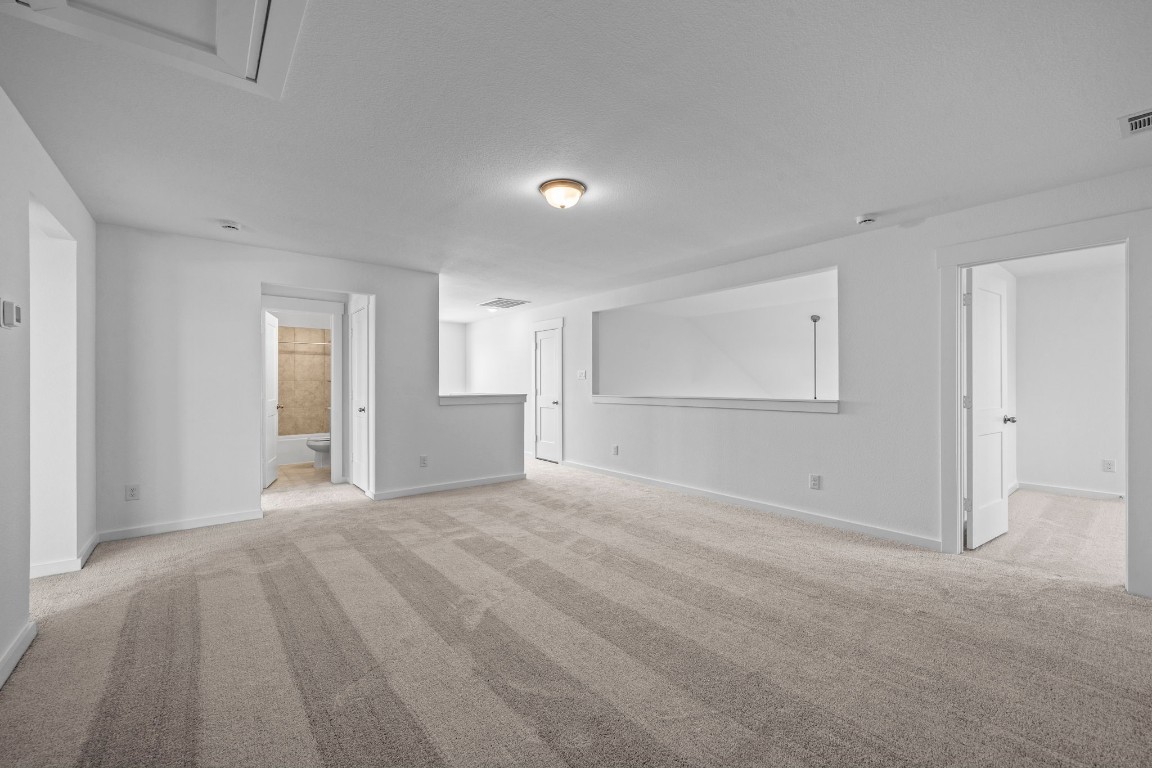 305 Gambels Quail Road Waller, TX 77484 - Photo 13 of 26 The versatility of this room means it can easily shift from a playroom for the kids to a serene yoga studio where you can unwind after a long day.
