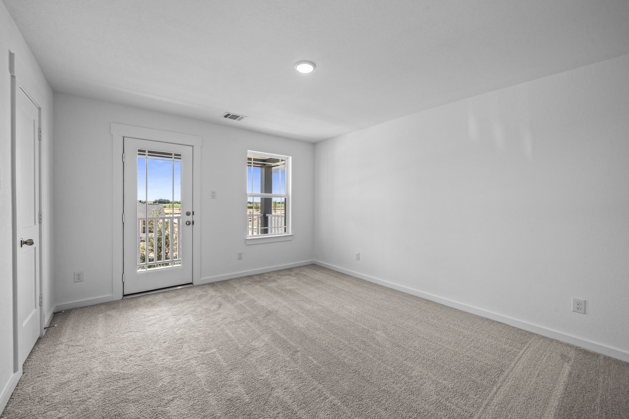 305 Gambels Quail Road Waller, TX 77484 - Photo 14 of 26 an empty room with windows and entrance