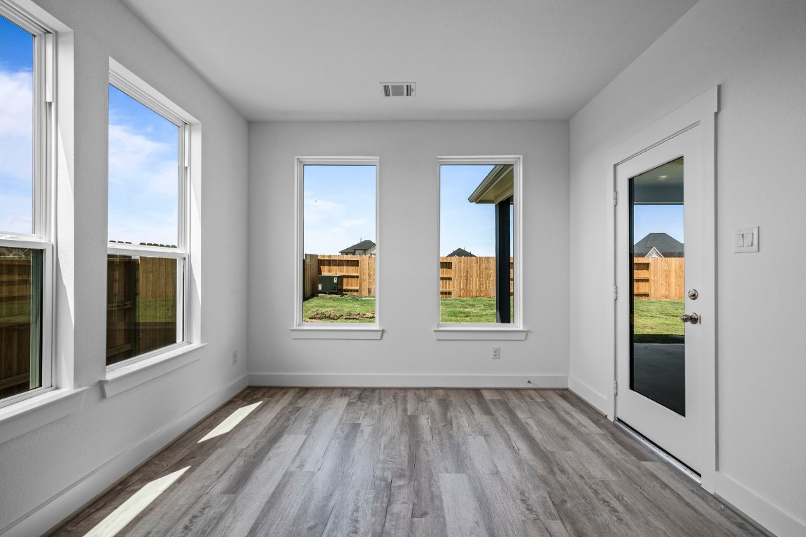 305 Gambels Quail Road Waller, TX 77484 - Photo 7 of 26 You'll love how the open layout seamlessly connects to the kitchen, making it easy to serve up your favorite dishes while still being part of the conversation.
