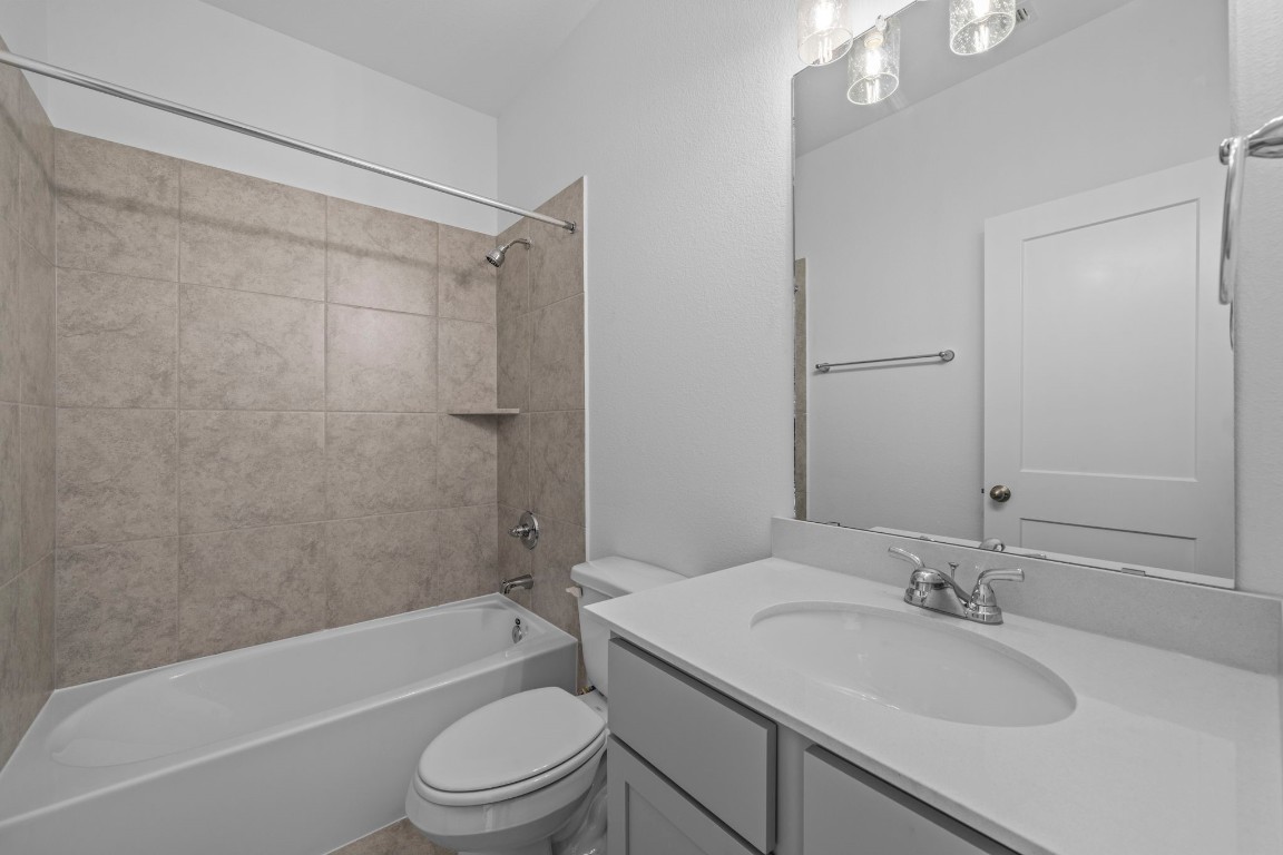 305 Gambels Quail Road Waller, TX 77484 - Photo 9 of 26 Whether you’re hosting family and friends or for the kiddos, our secondary bathrooms invite you to relax, refresh, and feel right at home.