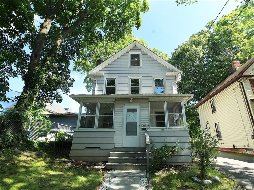 37 Quinlan Avenue Meriden, CT 06451 - Photo 1 of 1 a front view of a house with a yard