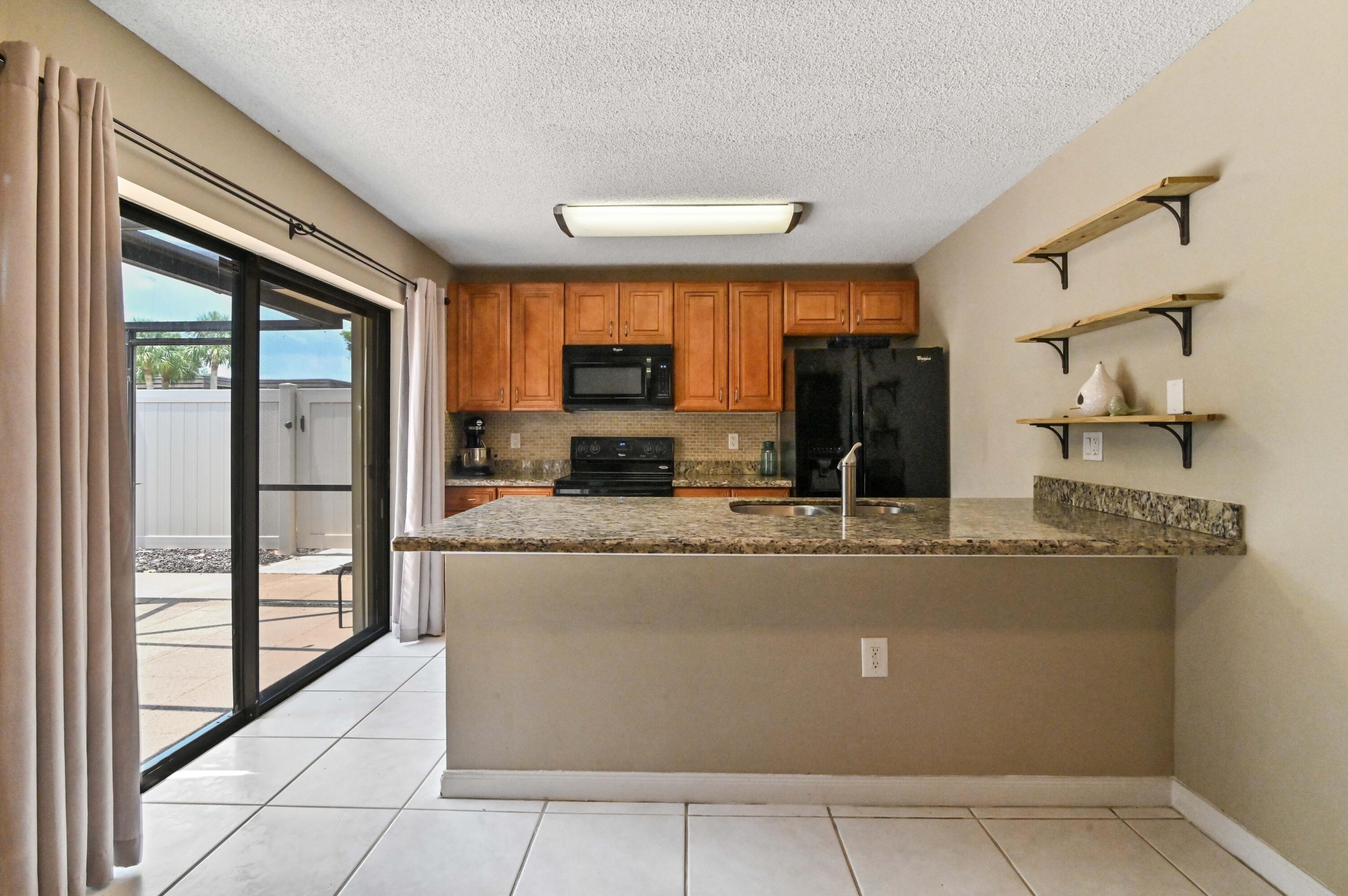 6927 69th Way West Palm Beach, FL 33407 - Photo 5 of 28 11 kitchen 01