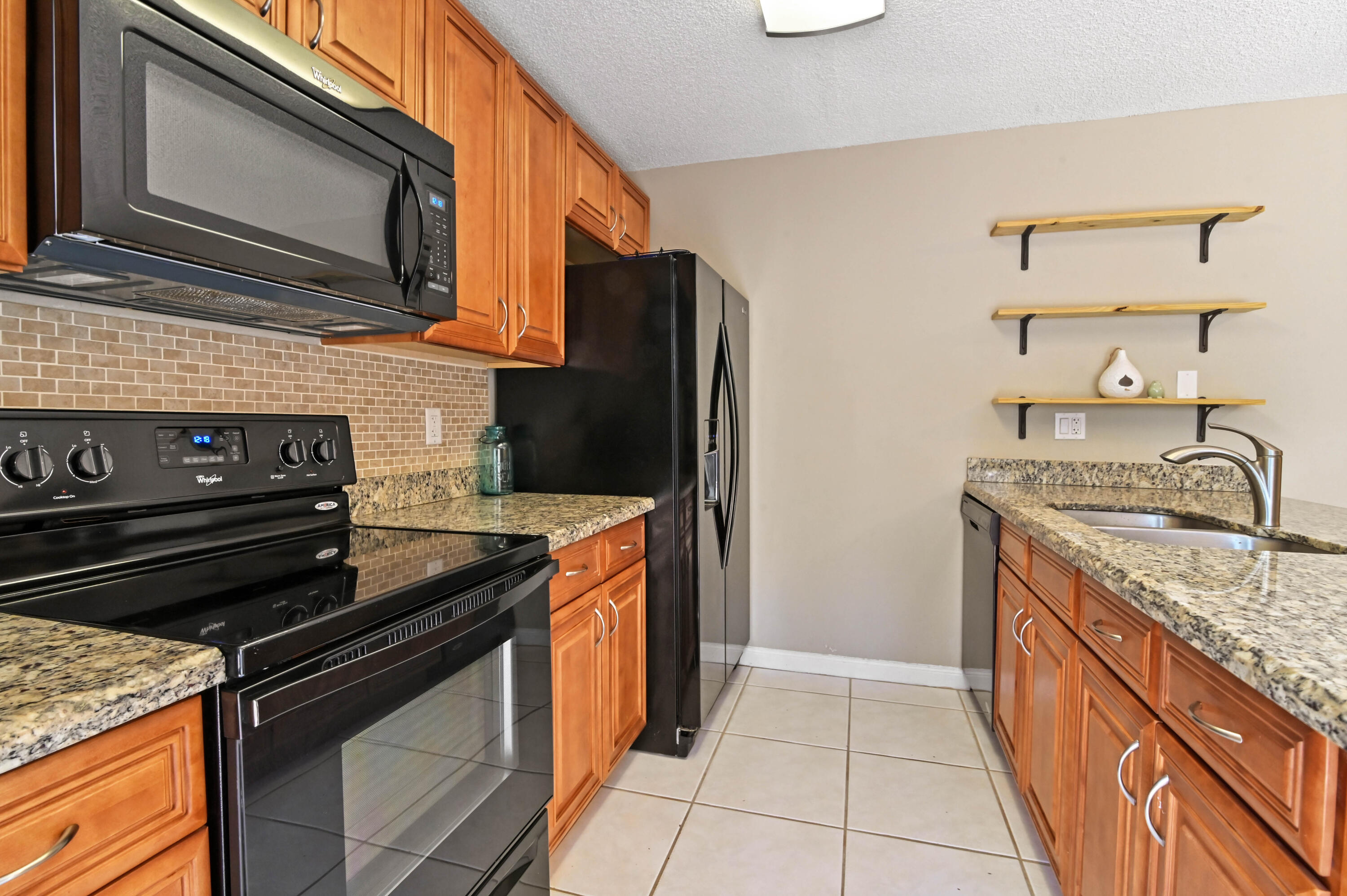 6927 69th Way West Palm Beach, FL 33407 - Photo 6 of 28 12 kitchen 02
